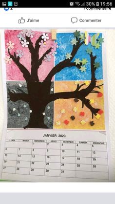 a calendar with pictures of trees and flowers on the front, which are colored in different colors