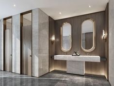 a bathroom with two sinks and three mirrors on the wall, along with marble flooring