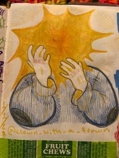 a drawing of a person holding their hands up in front of an advertisement for fruit chews