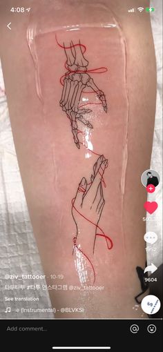 a person's legs with drawings on them and an image of their hands in the water