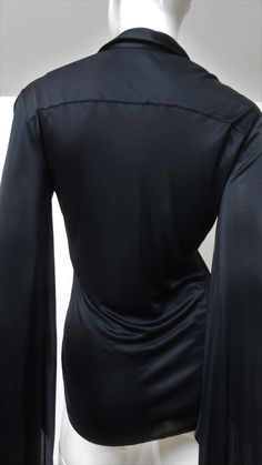 For Sale on 1stDibs - A fabulous black fine stretch silk shirt, top, blouse from Tom Ford for Gucci. It is semi fitted with a shirt collar, black mother of pearl Gucci inscribed Elegant Gucci Blouse For Party, Elegant Gucci Blouse For Evening, Elegant Gucci Party Blouse, Elegant V-neck Party Shirt, Gucci Collared Blouse For Formal Occasions, Gucci Formal Collared Blouse, Chic Gucci Collared Blouse, Gucci Black Top For Night Out, Gucci Long Sleeve Evening Tops