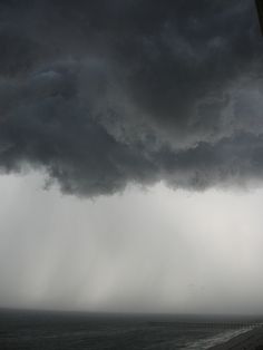 a storm is coming in over the ocean