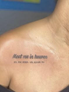 a person with a tattoo on their back saying meet me in heaven, all xxxv xxxv xxviii xx