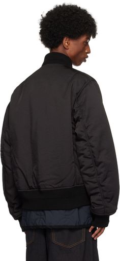 Padded rayon-blend gabardine bomber jacket. · Rib-knit stand collar, hem, and cuffs · Two-way zip closure · Concealed button placket · Press-stud tabs at chest · Welt pockets · Press-stud vent at side seams · Utility pocket at sleeve · Ruching at sleeves · Welt pockets at interior · Full quilted ripstop lining · Logo-engraved silver-tone hardware Part of the sacai x SPIEWAK collaboration. Supplier color: Black Classic Outerwear With Zip Cuffs For Streetwear, Silver Engraving, Press Studs, Button Placket, Welt Pockets, Welt Pocket, Stand Collar, Rib Knit, Silver Tone