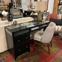 a living room filled with furniture and lots of pillows on top of a carpeted floor