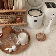 there are many items on the table including an air fryer and other kitchen accessories