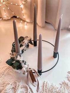 candles are arranged in the shape of a wreath