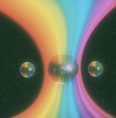 an image of two bubbles in the middle of some sort of space with different colors and shapes