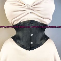 "New UNDERBUST from \"MystiC City Corsets\" design: MCC152 ORIGINAL design/photo: \"MystiC City Corsets\" - fashion layer: black cotton/black satin - lining: 100% cotton twill steel boning - 6 x 12mm wide \"white\" flat steel flexible bones - 10 x 6mm wide spiral steel bones ( sizes: 16, 18\" has 10 spiral bones) - steel busk - floating modesty panel: 5\" wide ( boned) - waist tape - high quality 1/4\" grommets waist can stretch a bit and sizes runs big for ex: size 22\" is more close to 23\"" Gothic Overbust Corset Belt With Medium Bust Support, Gothic Underbust Corset Belt With Boning, Black Fitted Corset Belt For Costume, Steampunk Black Underbust Corset Belt, Black Underbust Corset Belt For Costume, Black Underbust Corset Belt For Cosplay, Elegant Underbust Corset Belt For Cosplay, Fitted Satin Underbust Corset Dress, Underbust Corset Belt For Costume Party