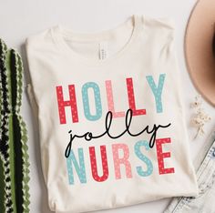 Be a Holly Jolly Nurse this Christmas with this festive Christmas Shirt! Adorned with snowflakes on the lettering, this Holly Jolly Nurse shirt is perfect to keep you merry and bright this season. It is a Unisex tee with short sleeves that fits like a well-loved favorite. Soft cotton and quality print make users fall in love with it over and over again. These t-shirts have-ribbed knit collars to bolster shaping. The shoulders have taping for better fit over time.  Dual side seams hold the garment's shape for longer.  100% Airlume combed and ringspun cotton (fiber content may vary for different colors) Light fabric (4.2 oz/yd² (142 g/m  Retail fit  Tear away label  Runs true to size Retro Tshirt, Traveling Retro Shirt, Adventure 70s Style, It's a beautiful Day for an Adventure T-Shirt Holiday Nurse Shirt, Christmas Nurse Shirts Sublimation, Nursing Christmas Shirts, Nurse Christmas Shirts, Nurse Fashion, Nurse Accessories, Nurse Shirts, Nursing Fashion, Nursing Accessories