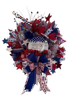 a patriotic wreath with red, white and blue decorations