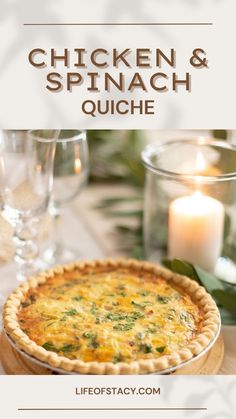 a chicken and spinach quiche on a table with candles