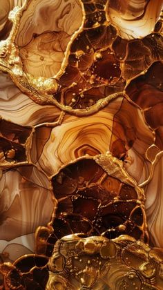 an abstract painting with gold and brown colors