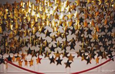 some gold stars are hanging on the wall