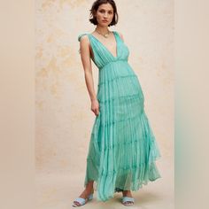 Just As Effortless As It Is Ethereal, This Stunning Maxi Gown Is Featured In A Gorgeous, Drapey Design With Deep V-Neckline, Tiered Bottom Skirt, And Metallic Threading Throughout For An Added Special Touch. Fit: Flowy, Relaxed Fit Features: V-Neckline, Shoulder Ties, Empire Waist, Dropped Armholes, Tiered Silhouette, Fully Lined Style Why We <3 It: Shine Bright In This Stunning Maxi Dress Designed To Turn Heads At Absolutely Any Special Event. Fp One Old World Embellishment With A Modern Twist. Maxi Dress Free People, Maxi Dress Designs, Maxi Gown, Maxi Gowns, Threading, Free People Dress, Shine Bright, Empire Waist, Blue Dress