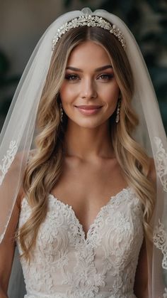 a woman wearing a wedding veil and smiling at the camera