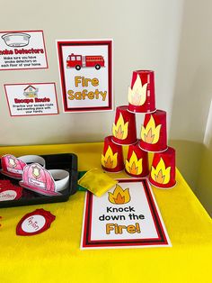 a table with fire safety signs and other items on it