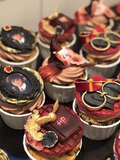 many cupcakes are decorated with pictures and decorations