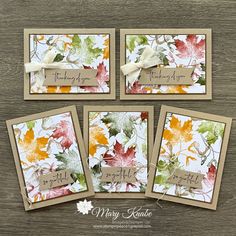 four cards with autumn leaves on them