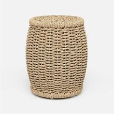 a small round woven basket on a white background, with the lid up and bottom down