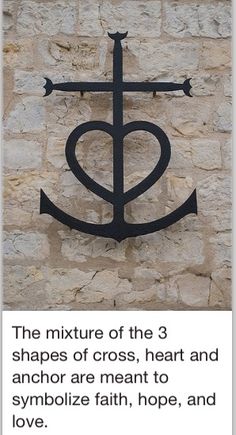 an anchor and heart sign on the side of a building