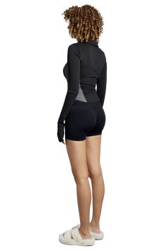 This jacket is a fusion of athleticism and sleek design, perfect for a range of activities from casual wear to light workouts. It’s a fitted, long-sleeved piece that emphasizes a streamlined silhouette with its contrast paneling. The fabric is stretchable blend, which provides both comfort and a flattering fit. The jacket features a full-zip front, which makes it convenient for layering and temperature control. Additionally, the high collar adds both warmth and style. Long Sleeve Nylon Winter Top, Long Sleeve Nylon Top For Winter, Fitted Winter Sports Tops, Fitted Winter Sportswear Tops, Fitted Sportswear Tops For Winter, Winter Fitted Sportswear Tops, High Stretch Nylon Tops For Winter, Winter Compression Moisture-wicking Tops, Winter Sporty Fitted Tops