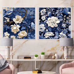 two blue and white floral paintings in a living room