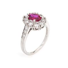 This is part of Chairish’s Fine Jewelry assortment.  Vintage Tiffany & Co ruby & diamond cluster ring crafted in 900 platinum (circa 1960s).    Oval mixed cut natural ruby measures 7.1 x 5.4 x 3.0mm (estimated at 1 carat). Color and inclusions are typical of rubies from Burma (Myanmar). There is no evidence of any treatments to the ruby. Sixteen diamonds total an estimated 0.70 carats (estimated at F-G color and VS clarity). The ruby is in good condition with two tiny chips evident (visible unde Classic Cluster Ruby Ring With Center Stone, Classic Ruby Cluster Ring With Center Stone, Classic Cluster Ruby Ring, Classic Ruby Cluster Ring With Gemstone, Cluster Ruby Diamond Ring With Center Stone, Formal Ruby Ring With Platinum Center Stone, Formal Multi-stone Ruby Ring In Cubic Zirconia, White Gold Ruby Cluster Ring With Brilliant Cut, Formal Multi-stone Ruby Ring With Cubic Zirconia