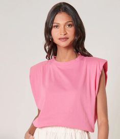 The chicest and most comfortable top is finally here. This London sleeveless muscle top has a crew neckline, relaxed fit, with shoulder pads to give you a chic look. It is made of a soft breathable 100% cotton and is perfect to dress up or down. Throw on some trousers and heels for dressed up look or keep it casual with sneakers and jeans or biker shorts. Pink Everyday Tank Top, Chic Crew Neck Tank Top For Summer, Pink Sleeveless Top For Everyday, Summer Chic Crew Neck Tank Top, Trendy Sleeveless Muscle Tee For Spring, Spring Everyday Muscle Tee, Spring Everyday Muscle Tank Tee, Spring Muscle Tank Tee For Everyday, Chic Tops With Padded Shoulders For Spring