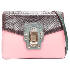 DOLCE GABBANA Lucia pink grey scaled leather flap clasp crossbody bag Reference: TGAS/D00703 Brand: Dolce Gabbana Designer: Domenico Dolce and Stefano Gabbana Model: Lucia Material: Leather Color: Pink, Grey Pattern: Animal Print Closure: Buckle Lining: Green Leather Extra Details: Mirror inside. Scaled leather at flap and side gusset. Push lock closure. Leather lining. Inside pocket with zipper closure. Made in: Italy CONDITION: Condition: Excellent, this item was pre-owned and is in excellent condition. Minor hairline scratches on hardware. Gentle scuff marks inside bag. Comes with: One dust bag. MEASUREMENTS: Width (width across base): 21cm / 8.2" Height (base to opening): 16cm / 6.2" Depth (side depth): 7cm / 2.7" Handle drop: 29cm / 11.3" This Dolce Gabbana item is authentic. Bag Reference, Stefano Gabbana, Inside Bag, Bag Measurements, Pattern Animal, Crossbody Bag Women, Grey Pattern, Dolce & Gabbana, Green Leather