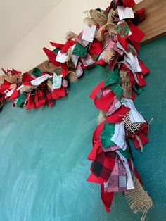 some very pretty red and green decorations on the wall in front of a door way