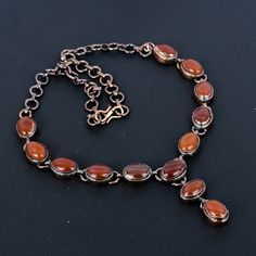 Welcome to our little shop, where you can find handmade copper wire jewelry and more, for you and your loved ones. We do accept custom orders also, kindly message us for more. Red Carnelian Necklace, Electroformed Copper Necklace Natural Carnelian Jewelry Adjustable Chain Necklace Unique Wedding & Anniversary Gifts Gemstone         : Red Carnelian Metal                  : Copper  * Protection:- Copper will be tarnished after a while so try to limit contact with lotions, soaps or anything moist and never wear it in the shower, swimming or anywhere else it may come in contact with water. If tarnish becomes an issue, you may clean this item with jewelry cleaning cloth or ultra polishing pads. * Packing:- Your jewelry arrived in a beautiful gift box stored in bubble wrap for safe travel. * Rus Luxury Carnelian Artisan Necklace, Vintage Silver Carnelian Necklace, Luxury Vintage Carnelian Necklace, Silver Carnelian Jewelry Hand-strung, Red Carnelian Polished Necklace, Unique Wedding Anniversary Gifts, Red Carnelian Artisan Necklace, Red Carnelian, Carnelian Jewelry