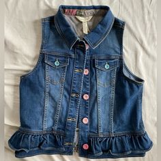 Super Stylish Jean Vest Ready To Spruce Up The Spring And Summer Wardrobe! Sz14 Nwt Cute Blue Tops With Pockets, Cute Blue Denim Tops, Spring Denim Button-up Vest, Summer Button-up Washed Blue Denim Vest, Vintage Blue Sleeveless Denim Vest, Cheap Light Wash Button-up Denim Vest, Washed Blue Button-up Denim Vest, Jean Vest, Stylish Jeans