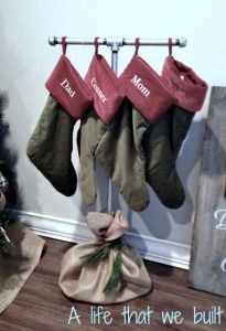 christmas stockings hanging from a rack with the words, a life that we built on it