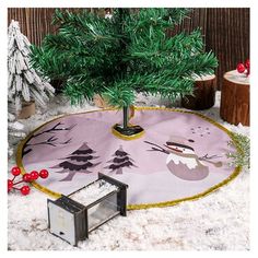 a small christmas tree on a pink rug