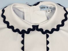 Boy's white shirt. Crisp White poplin shirt...vintage style with Peter Pan collar and red jumbo ric-rac trim. Perfect for up and coming street parties. 6-12m 12-18m 18-2 2-3yr 3-4yr 4-5yr 5-6yr 6-7yr From a smoke and pet free home. Wedding Preppy, White Poplin Shirt, Peter Pan Shirt, Ruffle Outfit, Cotton Romper, Retro Shirts, Clothing Sets, Poplin Shirt