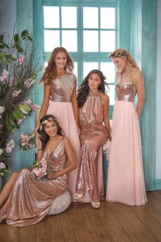 the bridesmaids are posing for a photo together in their pink and gold dresses