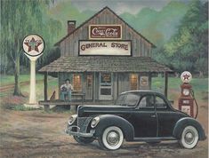 an old car is parked in front of a gas station with a man sitting outside