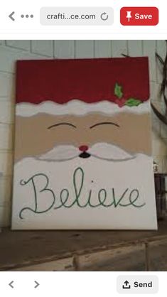 a sign that says believe on it with santa's face painted on the side