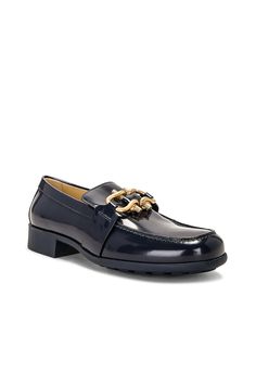 Find BOTTEGA VENETA Monsieur Loafer In Navy on Editorialist. Bottega Veneta Monsieur Loafer in Navy Leather upper and sole. Made in Italy. Slip-on styling. Gold-tone hardware at vamp. Leather footbed and lining. Rounded square toe. Approx 40mm/ 1.5 inch heel. BOTT-WZ483. 708902-V28R0-4259. About the designer: Bottega Veneta – inspiring individuality with innovative craftmanship since 1966. Creativity lies at the heart of all that we do. Born in Vicenza the house is rooted in Italian culture yet Rounded Square, Italian Culture, Bottega Veneta Shoulder Bag, Loafer Mules, Navy Leather, 5 Inch Heels, Black Pumps, Leather Loafers, Italian Leather