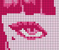 a cross - stitch pattern of a woman's face with pink lipstick on it