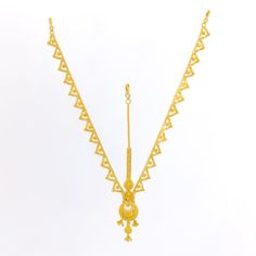 This elegant 22k gold matha patti, weighing 18.8 grams, features a radiant yellow gold finish and an attractive design. The tikka measures 5.5 inches in length, while the side chains are 6.75 inches long, ensuring a perfect fit and graceful drape. The matha patti is secured with a hook clasp style, adding ease of wear. Ideal for those who appreciate dressy and sophisticated jewelry, this piece combines timeless beauty with an alluring charm, making it a perfect choice for any special occasion or cultural celebration. PRODUCT DETAILS Gold Purity(karat): 22k Gold Weight(grams): 18.8 Item Finish: Yellow Gold Tikka Length: 5.5" Side Chain Length: 6.75" Clasp Style: Hook 22k Gold Tikka With Intricate Design, Festive Yellow Gold Tikka With Tilla, Festive Yellow Gold Tilla Tikka, Festive 22k Gold Tikka, Traditional 22k Gold Tikka, Festive Gold-plated Tikka, Elegant Gold Tikka For Puja, Gold Hand Set Tikka For Puja, Adjustable Gold Tikka For Diwali