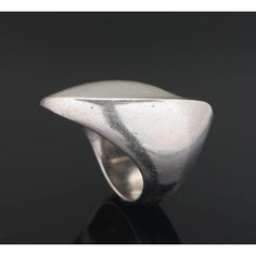 A nanna ditzel for georg jensen sterling silver ring. Designed as a curved undulating sculptural form. It sits beautifully on the finger, catching light from different angles. The ring size is 16/56. Its signed 'georg jensen, 925, denmark, 91    weight: approx. 15 grams.  nanna ditzel (1923 - 2005) is regarded as one of denmark’s most accomplished midcentury designers and she was the first woman to design for the georg jensen silversmithy in 1954. Her work has been exhibited at the metropolitan Modern Sculptural Jewelry With Polished Finish, Modern Sculptural Jewelry, Modern Curved Rings With Polished Finish, Georg Jensen Jewelry, Nanna Ditzel, Different Angles, Georg Jensen, Sterling Silver Ring, Denmark