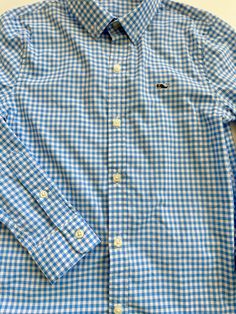 Light blue and white gingham plaid button down long sleeve shirt by Vineyard Vines. The Performance material; 91% nylon, 9% spandex. Size 6 $20 By Vineyard Vines Long Sleeve Gingham Shirt With Button Closure, Preppy Plaid Long Sleeve Shirt, Preppy Long Sleeve Plaid Shirt, Fitted Gingham Button-up Shirt, Fitted Gingham Casual Shirt, Preppy Long Sleeve Shirt For Summer, Fitted Plaid Shirt For Spring, Casual Gingham Long Sleeve Top, Casual Long Sleeve Gingham Top