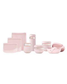 a set of pink dishes and cups on a white background