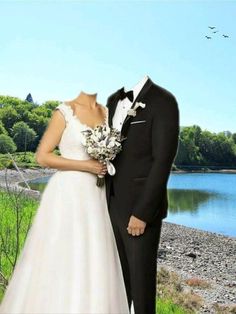 a bride and groom are standing in front of a lake