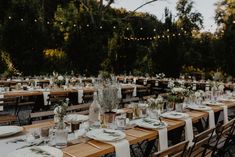 a table set up for an outdoor wedding reception