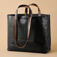 Crafted from sturdy, pliable leather, this tried-and-true tote is practical for everyday use and substantial enough to take on a weekend getaway. It's structured, yet slouchy and held together with durable, two-tone handles that make the load feel that much lighter.CARMIN BLACK crafts sustainable leather goods through ethical manufacturing and partnering with local artisans in India. Using all locally-sourced materials, each bag is an advancement tool for fighting hunger and poverty in developin Sustainable Leather, Black Leather Tote Bag, Black Leather Tote, Black Tote, Local Artisans, Weekend Getaway, Vegetable Tanned Leather, Leather Goods, Leather Tote Bag