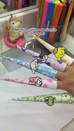 there are many different toothbrushes on the counter in front of someone's hand