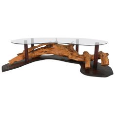 a glass table with wooden logs on it